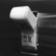 Closeup black and white image of an On switch